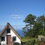 Me infront of the "shack" and antennas - a vertical at the right side